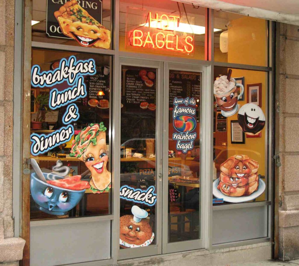 Fun characters fill bagel shop storefront windows with personality